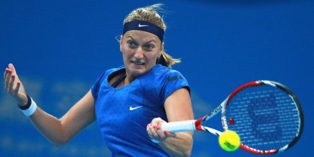 BEIJING, CHINA - OCTOBER 05: Petra Kvitova of Czech Republic returns a shot during the Women's Single Final against Maria Sharapova of Russia on day nine of the China Open at the China National Tennis Center on October 5, 2014 in Beijing, China. (Photo by Feng Li/Getty Images)