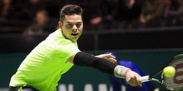 Canada's Milos Raonic returns the ball to Russia's Andrey Kuznetsov during their ABN AMRO World Tennis Tournament match in Rotterdam on February 10, 2015. AFP PHOTO / ANP KOEN SUYK netherlands out (Photo credit should read KOEN SUYK/AFP/Getty Images)