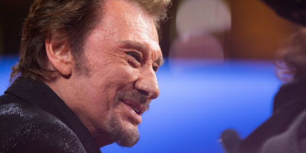 PARIS, FRANCE - DECEMBER 06: Singer Johnny Hallyday attends the 'France Television Telethon 2014' TV show on December 6, 2014 in Paris, France. (Photo by Richard Bord/Getty Images)