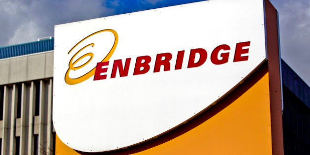 Enbridge Inc. signage is displayed outside of the company's corporate office in Toronto, Ontario, Canada, on Friday, Oct. 28, 2011. Enbridge Inc. provides energy transportation, distribution, operates crude oil and liquids pipeline systems, natural gas transmission for midstream businesses in North America and internationally. Photographer: Brent Lewin/Bloomberg via Getty Images