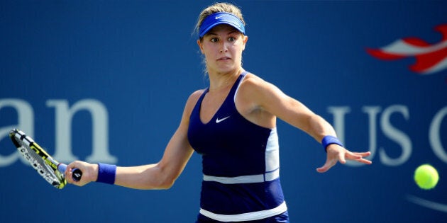 NEW YORK, NY - AUGUST 26: Eugenie Bouchard of Canada returns a shot against Olga Govortsova of Belarus during their women's singles first round match on Day Two of the 2014 US Open at the USTA Billie Jean King National Tennis Center on August 26, 2014 in the Flushing neighborhood of the Queens borough of New York City. (Photo by Al Bello/Getty Images)