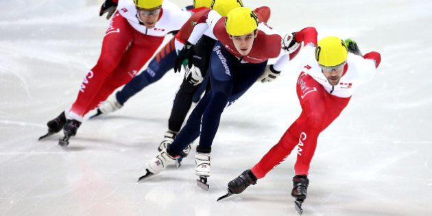 DRESDEN, GERMANY - FEBRUARY 08: #120 Francois Hamelin of Canada (R) leads the pack down the straight during the Men's 500m Mens A final on day 2 of the ISU World Cup Short Track Speed Skating on February 8, 2015 in Dresden, Germany. (Photo by Jordan Mansfield - ISU/Getty Images for ISU)