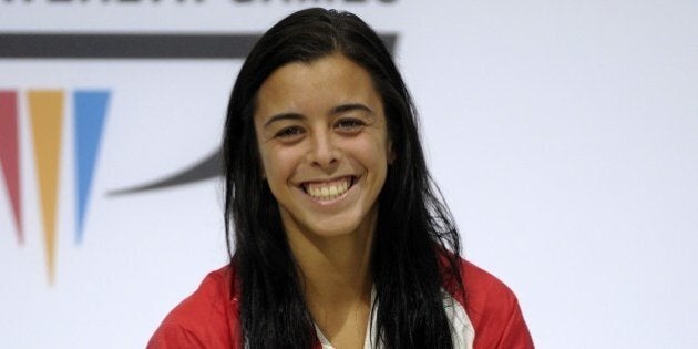 Gold Medalist Meaghan Benfeito of Canada poses with her medal after the women's 10 M platform diving final at the Royal Commonwealth Pool in Edinburgh, Scotland on day eight of the 2014 Commonwealth Games,on July 31, 2014. AFP PHOTO/ ANDY BUCHANAN (Photo credit should read Andy Buchanan/AFP/Getty Images)