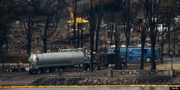 LAC-MEGANTIC QC - JULY 9: A mobile labratory operated between oil spill booms and the derailed train inLac-MÈgantic Tuesday afternoon. Saturday's derailment sent thousands of liters of crude into Lac-MÈgantic and down the ChaudiËre River threatening towns and ecosystems downstream. (Lucas Oleniuk/Toronto Star via Getty Images)