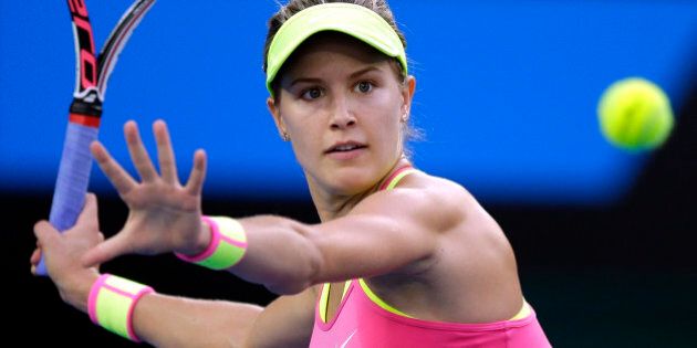 Eugenie Bouchard of Canada makes a forehand return to Kiki Bertens of the Netherlands during their second round match at the Australian Open tennis championship in Melbourne, Australia, Wednesday, Jan. 21, 2015. (AP Photo/Bernat Armangue)