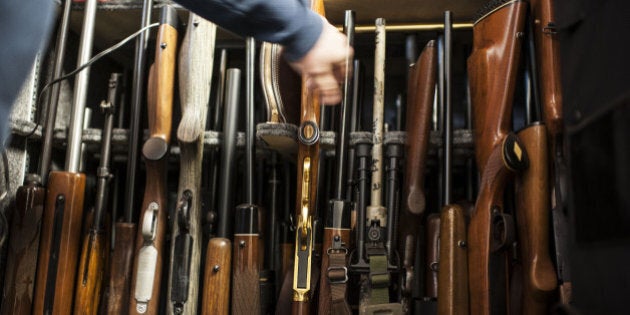 SCHALLER, IA - MARCH 19: Todd Bloyer points to his collection of guns within a inside a gun safe at his home in Schaller, Iowa, Tuesday, March 19, 2013. The Bloyer family owns over 300 guns. (Photo by Yue Wu/The Washington Post via Getty Images)