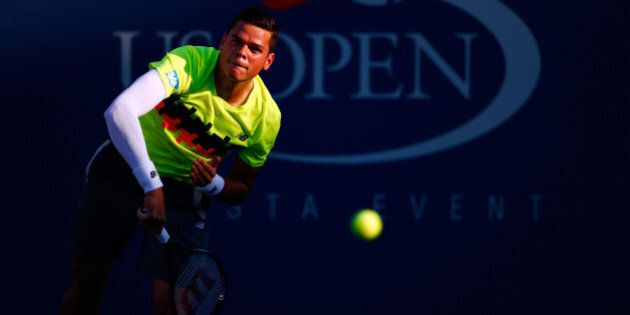 NEW YORK, NY - AUGUST 25: Milos Raonic of Canada returns a shot to Taro Daniel of Japan during his men's singles first round match on Day One of the 2014 US Open at the USTA Billie Jean King National Tennis Center on August 25, 2014 in the Flushing neighborhood of the Queens borough of New York City. (Photo by Julian Finney/Getty Images)