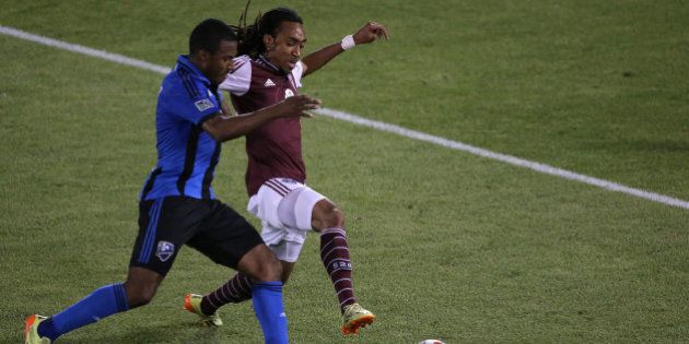 COMMERCE CITY, CO - MAY 24: Patrice Bernier #8 of the Montreal Impact and Marlon Hairston #94 of the Colorado Rapids battle for control of the ball at Dick's Sporting Goods Park on May 24, 2014 in Commerce City, Colorado. The Rapids defeated the Impact 4-1. (Photo by Doug Pensinger/Getty Images)