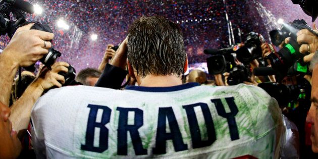 GLENDALE, AZ - FEBRUARY 01: Tom Brady #12 of the New England Patriots is surrounded by the media after defeating the Seattle Seahawks 28-24 during Super Bowl XLIX at University of Phoenix Stadium on February 1, 2015 in Glendale, Arizona. (Photo by Tom Pennington/Getty Images)