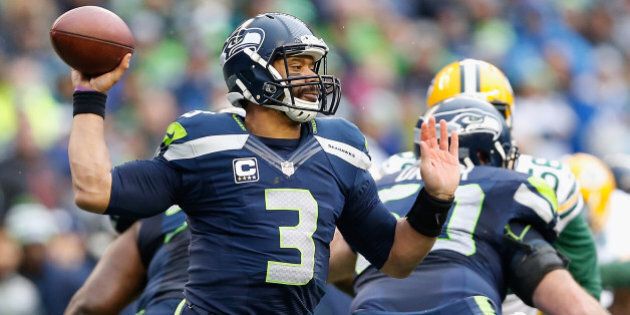 SEATTLE, WA - JANUARY 18: Quarterback Russell Wilson #3 of the Seattle Seahawks throws a pass during the 2015 NFC Championship game against the Green Bay Packers at CenturyLink Field on January 18, 2015 in Seattle, Washington. The Seahawks defeated the Packers 28-22 in overtime. (Photo by Christian Petersen/Getty Images)