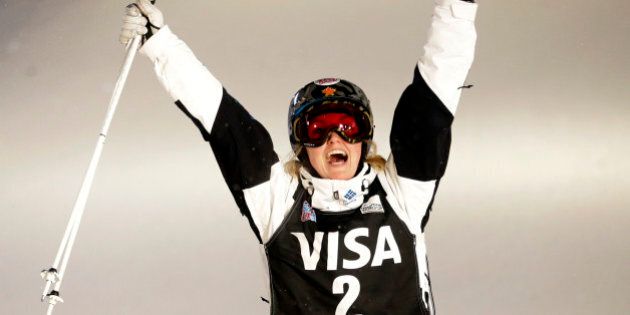 Justine Dufour-Lapointe, of Canada, celebrates after winning the women's freestyle skiing World Cup dual moguls, Saturday, Jan. 10, 2015, in Park City, Utah. (AP Photo/Rick Bowmer)