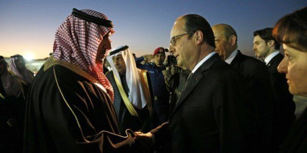 French President Francois Hollande (R) is welcomed by the Governor of the Riyadh Province, Turki bin Abdullah al-Saud (L) upon his arrival at Riyadh airport on January 24, 2015. World leaders headed to Saudi Arabia on January 24 to offer condolences following the death of King Abdullah. AFP PHOTO / POOL / YOAN VALAT (Photo credit should read YOAN VALAT/AFP/Getty Images)