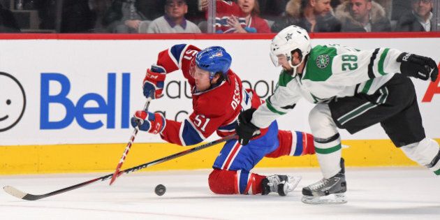 MONTREAL, QC - JANUARY 27: David Desharnais #51 of the Montreal Canadiens fights for the puck against David Schlemko #28 of the Dallas Stars in the NHL game at the Bell Centre on January 27, 2015 in Montreal, Quebec, Canada. (Photo by Francois Lacasse/NHLI via Getty Images)