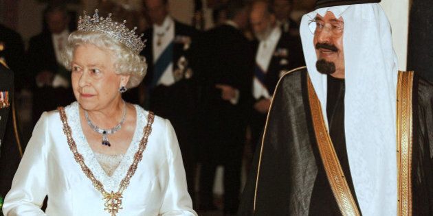 King Abdullah of Saudi Arabia, right, with Queen Elizabeth II, prior a state banquet at Buckingham Palace in London after the first day of the Saudi king's visit Tuesday Oct. 30, 2007. Britain's lavish welcome for Saudi Arabia's King Abdullah came under heavy criticism Tuesday from scathing newspaper editorials, protesters raising concerns over human rights abuses and an opposition party boycotting the visit. (AP Photo/John Stillwell, Pool)