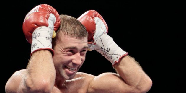 IBF Super Middleweight champion Lucian Bute of Canada reacts after knocking out Jean-Paul Mendy of France in Bucharest, Romania, Saturday night, July 9, 2011. Bute successfully defended his IBF Super Middleweight title.(AP Photo/Vadim Ghirda)
