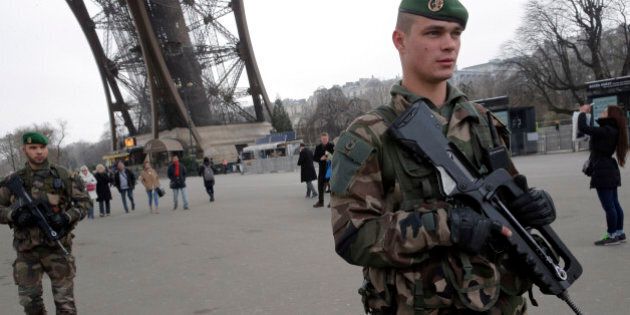 FILE - In this Wednesday Jan. 7, 2015, file photo, French soldiers patrol at the Eiffel Tower after a shooting at a French satirical newspaper in Paris, France. Though it is impossible to gauge in any tangible way the effect the deadly attack on a Paris newspaper will have on recruitment by extremist groups - and there is no evidence so far that it is mobilizing large numbers of would-be jihadis - experts believe the perceived professionalism of the brothers' assault and their subsequent showdown with police could rally more supporters to militant ranks. (AP Photo/Christophe Ena, File)