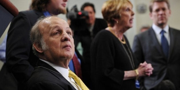 Former White House press secretary James Brady, his son Scott (behind Brady), and his wife Sarah visit the Brady Briefing Room at the White House March 30, 2011 in Washington, DC. Brady was left confined to a wheelchair in the attempted assassination of US president Ronald Reagan 30 years ago. AFP PHOTO/Mandel NGAN (Photo credit should read MANDEL NGAN/AFP/Getty Images)