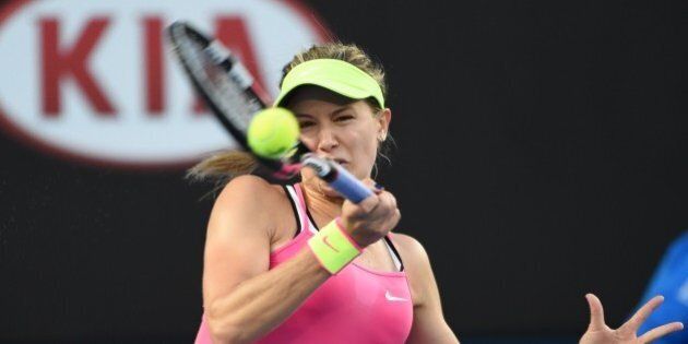 Canada's Eugenie Bouchard hits a return against Anne-Lena Friedsam of Germany during their women's singles match on day one of the 2015 Australian Open tennis tournament in Melbourne on January 19, 2015. AFP PHOTO / MAL FAIRCLOUGH-- IMAGE RESTRICTED TO EDITORIAL USE - STRICTLY NO COMMERCIAL USE (Photo credit should read MAL FAIRCLOUGH/AFP/Getty Images)