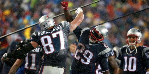 FOXBOROUGH, MA - JANUARY 18: Rob Gronkowski celebrates with LeGarrette Blunt after Gronkowski scores a touchdown in the third quarter at Gillette Stadium Sunday, January 18, 2015. AFC Championship Game between the New England Patriots and the Indianapolis Colts. (Photo by Jim Davis/The Boston Globe via Getty Images)