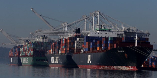 OAKLAND, CA - JANUARY 07: Container ships are seen docked at the Port of Oakland on January 7, 2015 in Oakland, California. A West Coast dock workers contract dispute that has been causing severe delays at West Coast ports since October is being blamed for a shortage of McDonald's french fries in Venezuala and Japan. More than 100 of Venezuela's McDonald's franchises are completely out of potatoes and have switched to alternatives like yuca, a staple of traditional South American cooking. (Photo by Justin Sullivan/Getty Images)