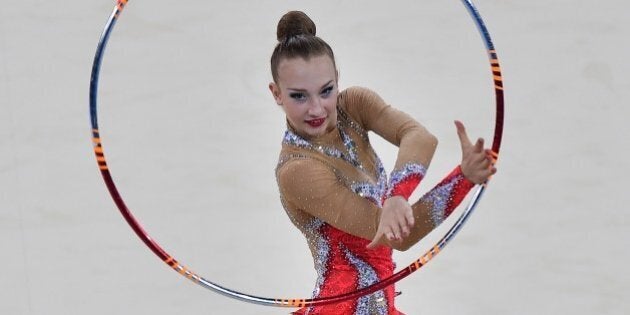 Canada's gold medalist Patricia Bezzoubenko competes in the hoop discipline, during the Individual All-Around Final of the Rhythmic Gymnastics event at The SSE Hydro venue at the 2014 Commonwealth Games in Glasgow July 25, 2014. AFP PHOTO/BEN STANSALL (Photo credit should read BEN STANSALL/AFP/Getty Images)