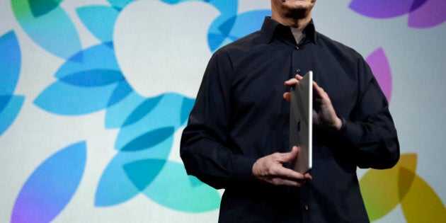 Apple CEO Tim Cook introduces the new iPad Air on Tuesday, Oct. 22, 2013, in San Francisco. (AP Photo/Marcio Jose Sanchez)