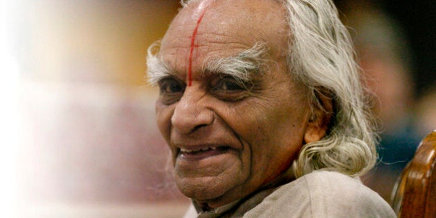 ESTES PARK, COLORADO-SEPT. 28, 2005-Sri B.K.S. Iyengar, recognized world-wide as a yoga master, taught an Iyengar Intennsive class to 800 students at The 10th Annual Yoga Journal Colorado Conference in Estes Park. Mr. Iyengar is the world's foremost living yogi and lives in India. He is 86 years-old and says that this is his last American trip to teach his pratice. Mr.Iyengar sits in a chair at the stage and greets the students at the beginning of the last day of the Iyengar Intensive class on Wednesday. (LYN ALWEIS/THE DENVER POST) (Photo By Lyn Alweis/The Denver Post via Getty Images)