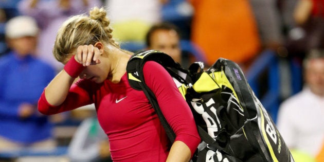 NEW HAVEN, CT - AUGUST 20: Eugenie Bouchard of Canada walks off the court after her match loss to Samantha Stosur of Australia during the Connecticut Open at the Connecticut Tennis Center at Yale on August 20, 2014 in New Haven, Connecticut. (Photo by Elsa/Getty Images)