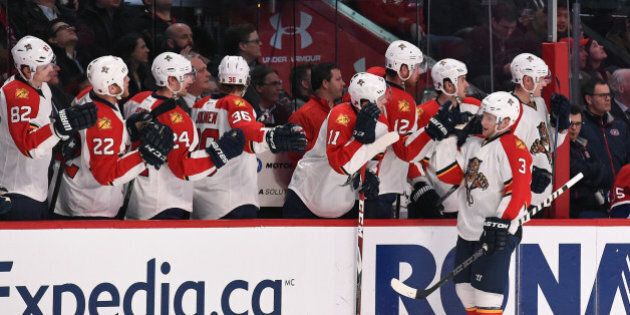 MONTREAL, QC - FEBRUARY 19: Steven Kampfer #3 of the Florida Panthers celebrates with the bench after scoring a goal against the Montreal Canadiens in the NHL game at the Bell Centre on February 19, 2015 in Montreal, Quebec, Canada. (Photo by Francois Lacasse/NHLI via Getty Images)