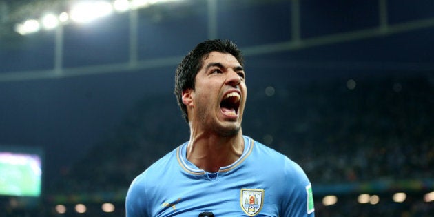 Uruguay's Luis Suarez celebrates scoring his side's second goal during the Group D match the Estadio do Sao Paulo, Sao Paulo, Brazil.