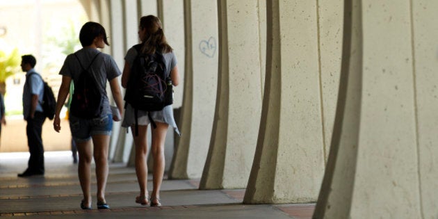 ADVANCE FOR USE FRIDAY, JUNE 17, 2011 AND THEREAFTER - Students at San Diego State University students walk on campus Tuesday, June 14, 2011, in San Diego. Among academics who track the behaviors of young adults and teens, thereâs a touchy debate: Should the word