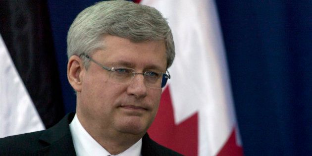 Canadian Prime Minister Stephen Harper attends a joint press conference with Palestinian President Mahmoud Abbas, at Abbas's headquarters, in the West Bank city of Ramallah, Monday, Jan. 20, 2014. (AP Photo/Nasser Nasser)