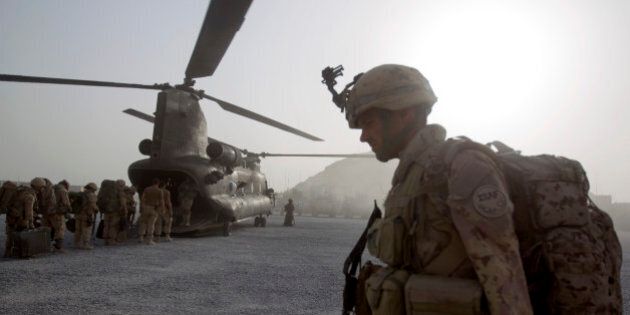 Cpl. Frederic Bouchard, 24, of Quebec, Canada, boards a helicopter at Forward Operating Base Sperwan Ghar with fellow soldiers of the Canadian Army's 1st Battalion Royal 22nd Regiment to begin their journey home Thursday, June 30, 2011 in the Panjwaii district of Kandahar province, Afghanistan. Canadian combat operations will end in July as troops withdraw from the southern region and hand control over to the Americans. Canada will transition to a non-combat training role with up to 950 soldiers and support staff to train Afghan soldiers and cops in areas of the north, west and Kabul. (AP Photo/David Goldman)