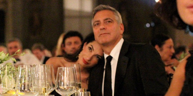 FLORENCE, ITALY - SEPTEMBER 07: George Clooney (R) and fiance Amal Alamuddin attend the Celebrity Fight Night gala celebrating Celebrity Fight Night In Italy benefitting The Andrea Bocelli Foundation and The Muhammad Ali Parkinson Center on September 7, 2014 in Florence, Italy. (Photo by Rachel Murray/Getty Images for Celebrity Fight Night)