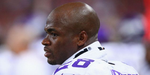 ST. LOUIS, MO - SEPTEMBER 7: Adrian Peterson #28 of the Minnesota Vikings looks on from the sideline during a game against the St. Louis Rams at the Edward Jones Dome on September 7, 2014 in St. Louis, Missouri. The Vikings beat the Rams 34-6. (Photo by Dilip Vishwanat/Getty Images)