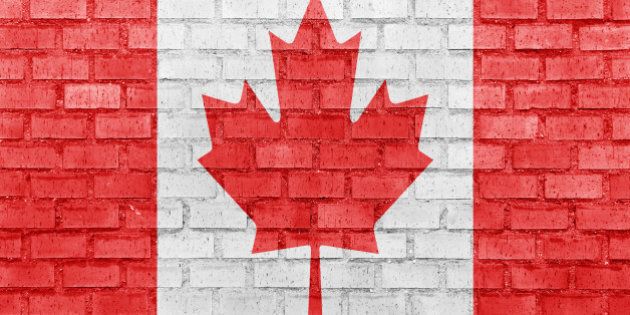 canada flag on a brick wall