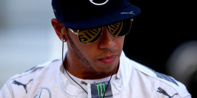 SOCHI, RUSSIA - OCTOBER 10: Lewis Hamilton of Great Britain and Mercedes GP looks on as he makes his way to the garage during practice ahead of the Russian Formula One Grand Prix at Sochi Autodrom on October 10, 2014 in Sochi, Russia. (Photo by Mark Thompson/Getty Images)