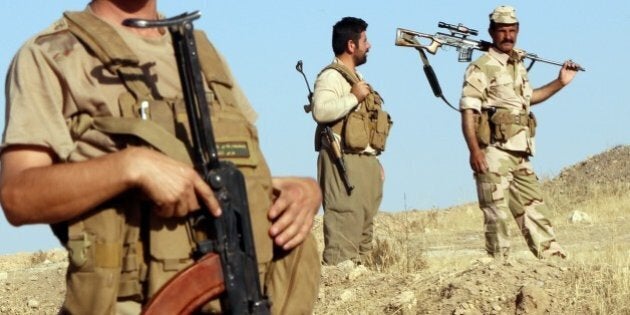 Iraqi Peshmerga fighters take position at a post near the jihadist-held city of Zumar in Mosul province on September 4, 2014. Iraqi security forces, now bolstered by thousands of Shiite militiamen as well as Kurdish fighters, have clawed back some ground northeast of Baghdad and Kurdish forces backed by Iraqi air are fighting to retake Zumar from Islamic-State (IS) militants. AFP Photo/ ALI AL-SAADI (Photo credit should read ALI AL-SAADI/AFP/Getty Images)