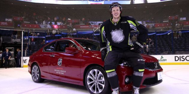 COLUMBUS, OH - JANUARY 25: Ryan Johansen #19 of the Columbus Blue Jackets and Team Foligno poses next to a Honda after being named MVP of the 2015 Honda NHL All-Star Game at Nationwide Arena on January 25, 2015 in Columbus, Ohio. (Photo by Bruce Bennett/Getty Images)