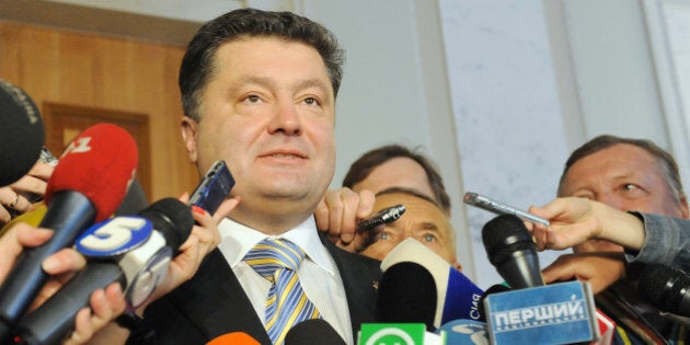 Ukraine's newly elected Foreign Minister Petro Poroshenko speaks to journalists in Kiev on October 9, 2009. Pro-Western President Viktor Yushchenko nominated Porochenko, 44, one of the country's richest men, whose candidacy was voted in by 240 deputies, more than the 226 required. AFP PHOTO/VOLODYMYR STRUMKOVSKY (Photo credit should read VOLODYMYR STRUMKOVSKY/AFP/Getty Images)