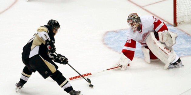 PITTSBURGH, PA - APRIL 09: Jussi Jokinen #36 of the Pittsburgh Penguins scores against Jonas Gustavsson #50 of the Detroit Red Wings during the shootout at Consol Energy Center on April 9, 2014 in Pittsburgh, Pennsylvania. The Penguins defeated the Red Wings 4-3 in a shootout. (Photo by Justin K. Aller/Getty Images)