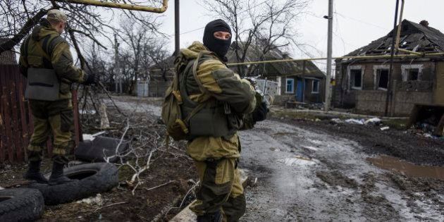 Russia-backed rebels take positions on the outskirts of Donetsk, eastern Ukraine, Thursday, April 2, 2015. OSCE monitors accompanied by pro-Russian rebels visited the ruins of Donetsk Airport and nearby areas to monitor the situation on the ground and discuss the observance of February's cease-fire. (AP Photo/Mstyslav Chernov)