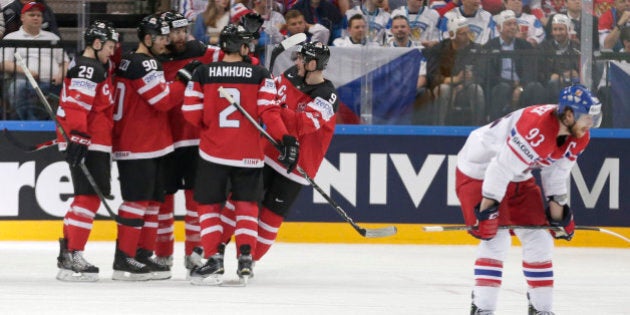 Canada's players celebrate a goal during the Hockey World Championships semifinal match against the Czech Republic in Prague, Czech Republic, Saturday, May 16, 2015. (AP Photo/Petr David Josek)