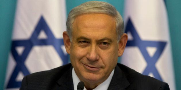 Israeli Prime Minister Benjamin Netanyahu smiles during a press conference at the prime minister's office in Jerusalem, Wednesday, Aug. 27, 2014. Israel's prime minister declared victory Wednesday in the recent war against Hamas in the Gaza Strip, saying the military campaign had dealt a heavy blow and a cease-fire deal gave no concessions to the Islamic militant group.(AP Photo/Sebastian Scheiner)