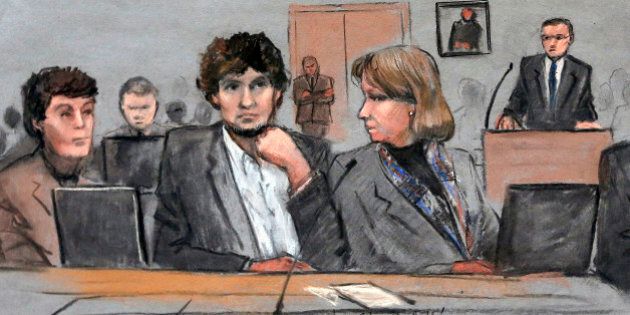FILE - In this March 5, 2015 file courtroom sketch, Dzhokhar Tsarnaev, center, is depicted between defense attorneys Miriam Conrad, left, and Judy Clarke, right, during his federal death penalty trial in Boston. Prosecutors rested their case against Tsarnaev on Monday, March 30, 2015, after jurors saw gruesome autopsy photos and heard a medical examiner describe the devastating injuries suffered by the three people who died in the 2013 terror attack. (AP Photo/Jane Flavell Collins, File)