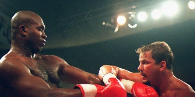 10 JUN 1995: DONOVAN RAZOR RUDDOCK OF THE USA (LEFT) GOES ON THE DEFENSIVE AGAINST TOMMY MORRISON OF THE USA DURING THEIR BOUT AT THE MUNICIPAL ARENA IN KANSAS CITY, MISSOURI. Mandatory Credit: Stephen Dunn/ALLSPORT