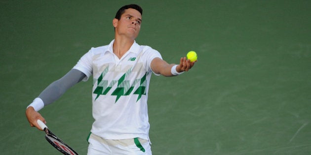 CINCINNATI, OH - AUGUST 13: Milos Raonic of Canada serves against Robby Ginepri during a match on day 5 of the Western & Southern open at Linder Family Tennis Center on August 13, 2014 in Cincinnati, Ohio. (Photo by Jonathan Moore/Getty Images)