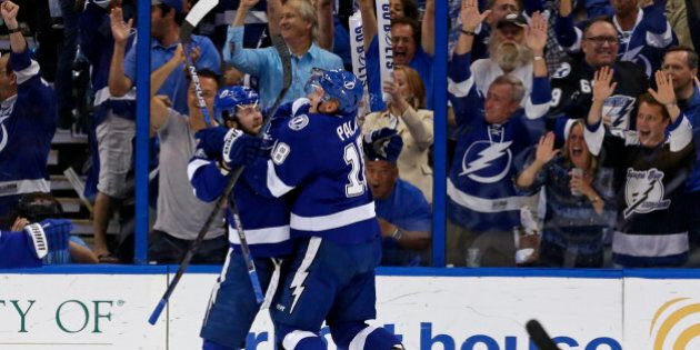 TAMPA, FL - MAY 12: Nikita Kucherov #86 of the Tampa Bay Lightning celebrates his goal with Ondrej Palat #18 against the Montreal Canadiens in Game Six of the Eastern Conference Semifinals during the 2015 NHL Stanley Cup Playoffs at Amalie Arena on May 12, 2015 in Tampa, Florida. (Photo by Mike Carlson/Getty Images)
