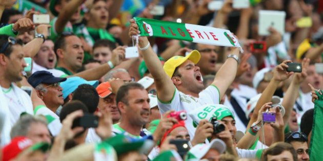 CURITIBA, BRAZIL - JUNE 26: Algeria fans cheer prior to the 2014 FIFA World Cup Brazil Group H match between Algeria and Russia at Arena da Baixada on June 26, 2014 in Curitiba, Brazil. (Photo by Jamie Squire/Getty Images)