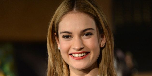 LONDON, ENGLAND - MARCH 20: Lily James attends the Cinderella Exhibition Launch Photocall at Leicester Square on March 20, 2015 in London, England. (Photo by Dave J Hogan/Getty Images)